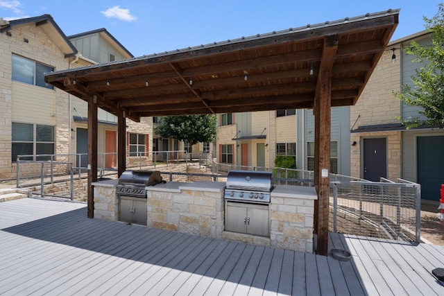 wooden terrace with area for grilling and grilling area