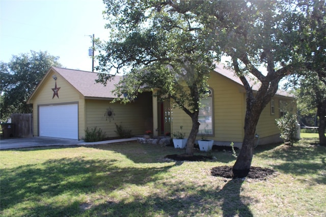 view of front of house with a garage and a front lawn