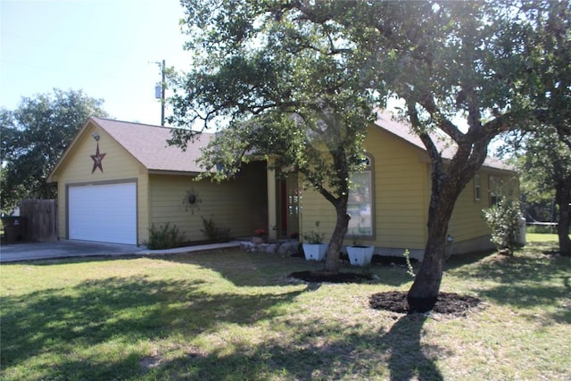 ranch-style house featuring a front yard and an attached garage