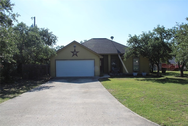 view of front of home featuring a garage and a front lawn