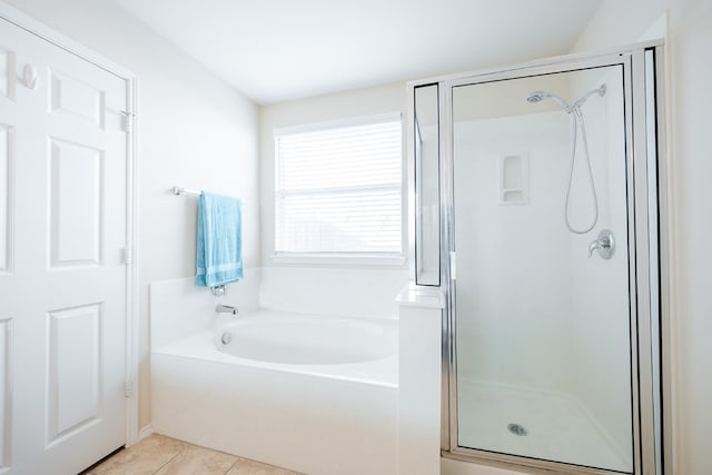 bathroom featuring tile patterned floors and independent shower and bath