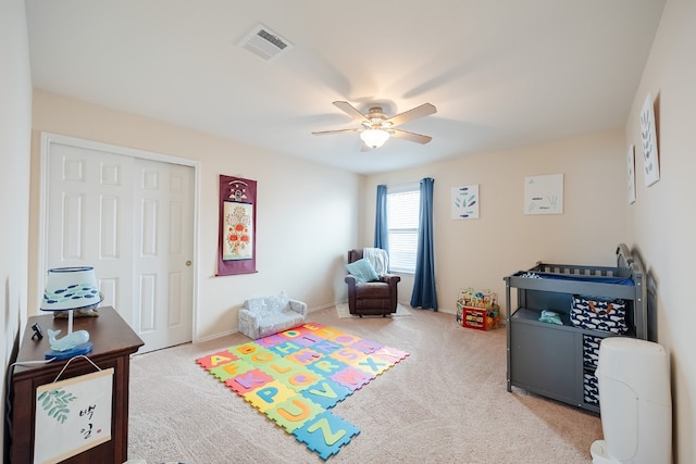 playroom featuring carpet and ceiling fan