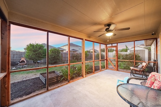 sunroom featuring ceiling fan