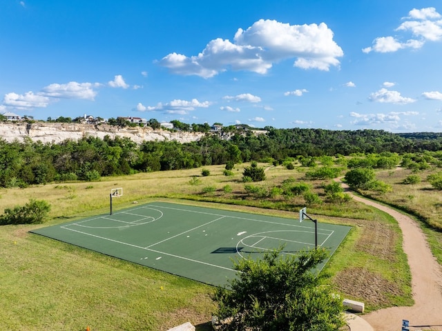 view of basketball court featuring a lawn