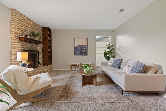 carpeted living room featuring a fireplace