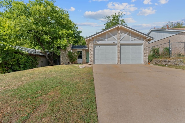 single story home with a front yard and a garage