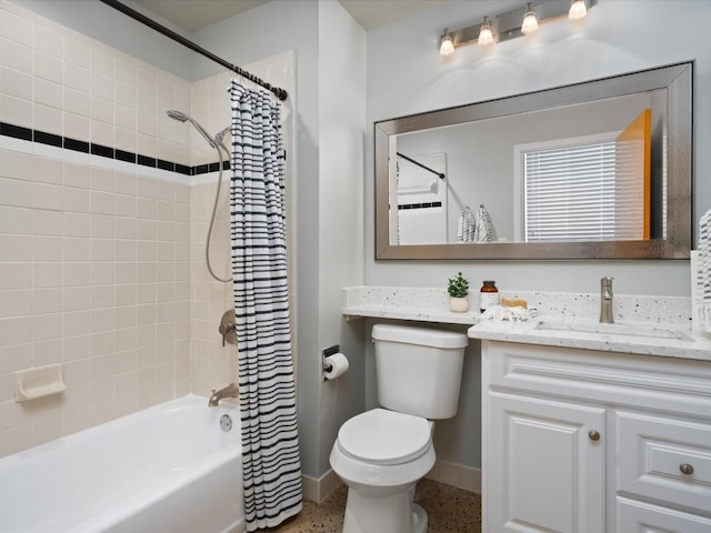 full bathroom with vanity, shower / bath combo, and toilet