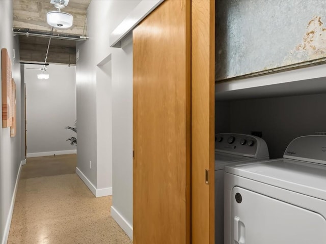 laundry room with independent washer and dryer