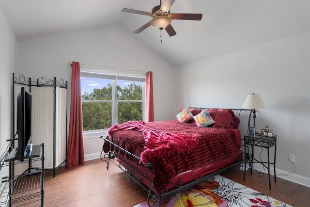 bedroom with wood-type flooring, vaulted ceiling, and ceiling fan