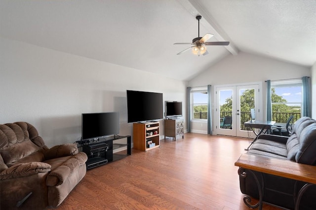 living room featuring wood-type flooring, lofted ceiling with beams, french doors, and ceiling fan