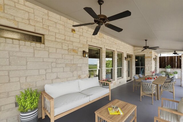 view of patio with an outdoor hangout area and ceiling fan