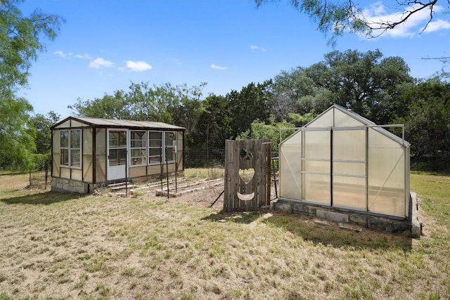 view of outbuilding with a lawn