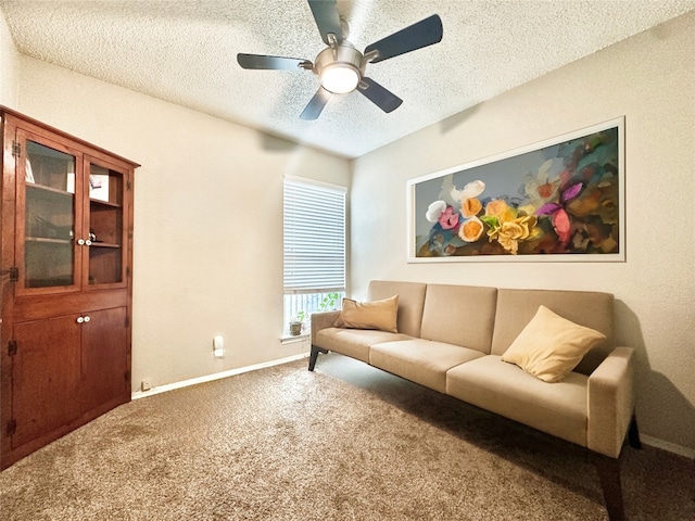 carpeted living room with a textured ceiling and ceiling fan