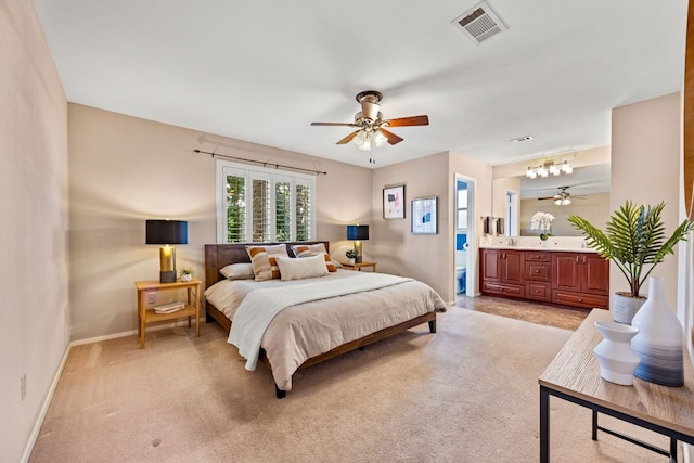 carpeted bedroom featuring ensuite bathroom and ceiling fan