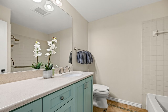 full bathroom featuring tile patterned floors, vanity, toilet, and tiled shower / bath combo