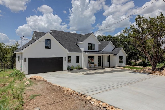 14208 Fort Smith Trl, Austin, TX 78734 - modern inspired farmhouse featuring covered porch, driveway, stucco siding, an attached garage, and a shingled roof
