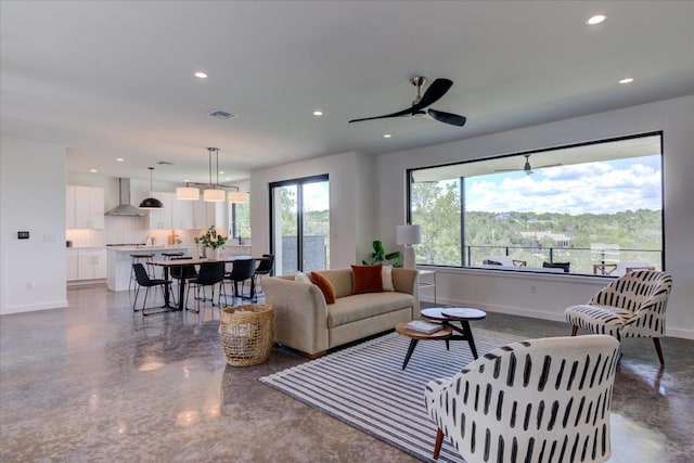 14208 Fort Smith Trl, Austin, TX 78734 - living room with concrete floors, recessed lighting, baseboards, and a ceiling fan