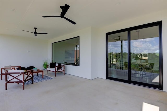 view of patio featuring an outdoor living space and ceiling fan