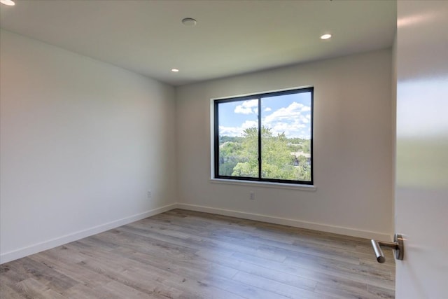 unfurnished room featuring light hardwood / wood-style flooring