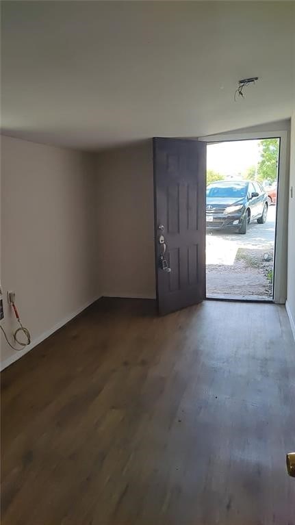 101 S Lockhart St, Manor, TX 78653 - foyer entrance with baseboards and dark wood finished floors