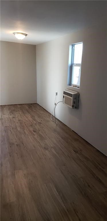 101 S Lockhart St, Manor, TX 78653 - unfurnished room featuring dark wood-style flooring and a wall mounted AC