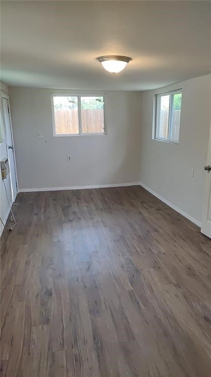 101 S Lockhart St, Manor, TX 78653 - spare room featuring baseboards and wood finished floors