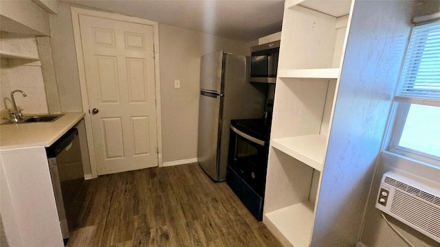 101 S Lockhart St, Manor, TX 78653 - kitchen with a sink, appliances with stainless steel finishes, dark wood-style floors, and light countertops