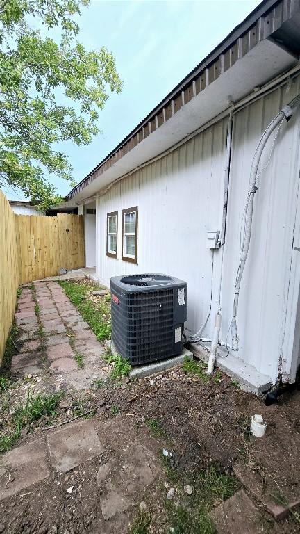 101 S Lockhart St, Manor, TX 78653 - view of property exterior with fence and central AC