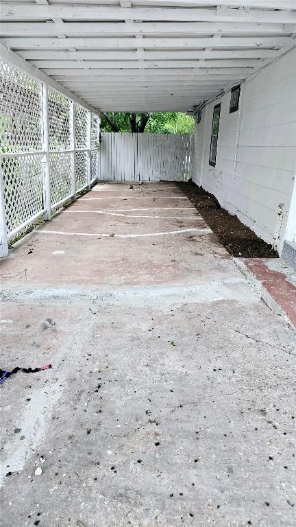 101 S Lockhart St, Manor, TX 78653 - view of patio with fence and an attached carport
