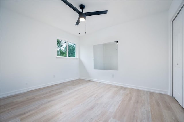 unfurnished room with ceiling fan and light hardwood / wood-style flooring