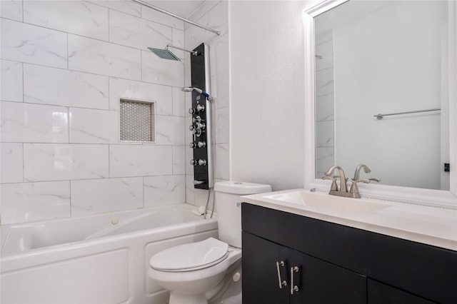 full bathroom with tiled shower / bath combo, toilet, and vanity