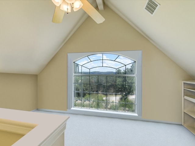 interior space featuring vaulted ceiling with beams, ceiling fan, and carpet flooring