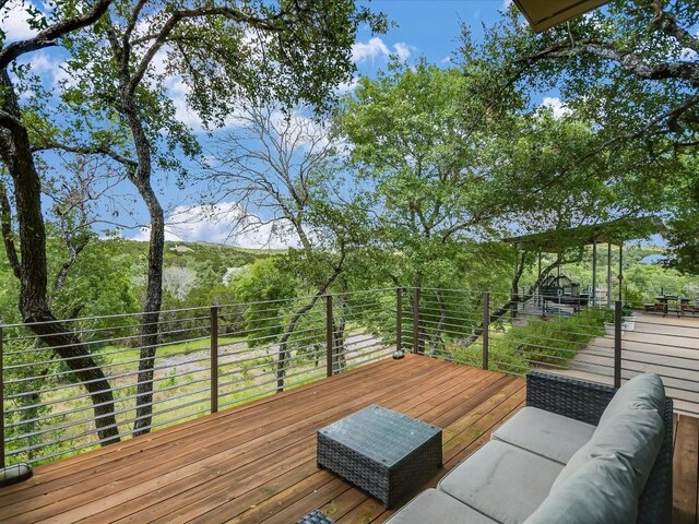 deck featuring outdoor lounge area