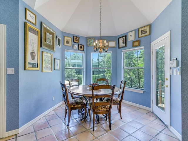 dining area featuring vaulted ceiling, a chandelier, and light tile patterned floors