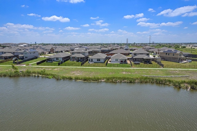 aerial view with a residential view and a water view