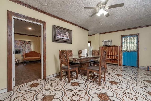 dining area with light hardwood / wood-style floors, ceiling fan, a textured ceiling, and crown molding