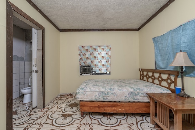 bedroom featuring connected bathroom and a textured ceiling