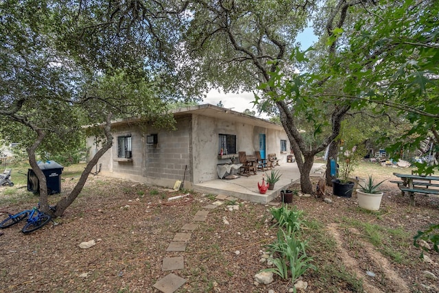 rear view of house featuring a patio area