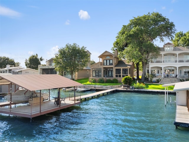 dock area featuring a balcony and a water view