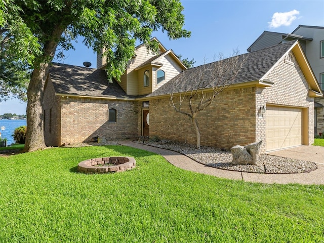 view of front of property with a front yard and a garage