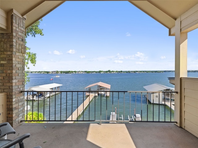 balcony featuring a water view