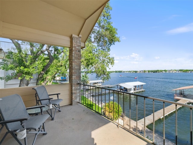 balcony featuring a water view