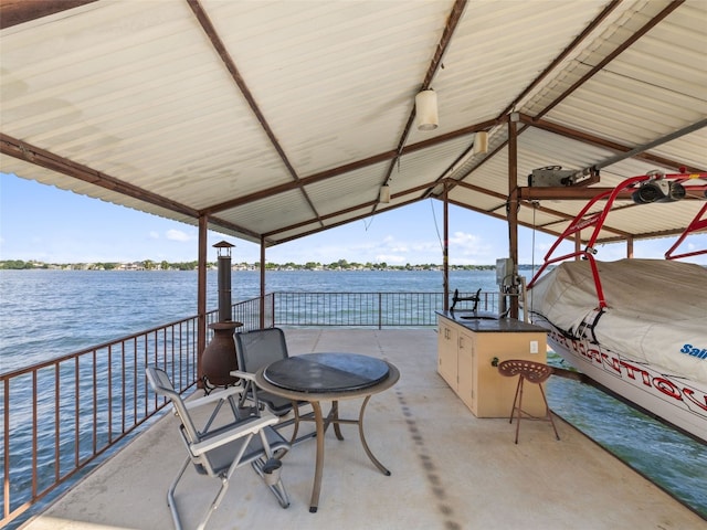 view of terrace with a water view