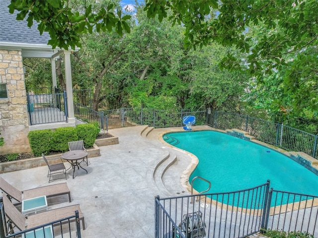 view of swimming pool featuring a patio area