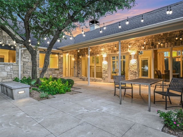 view of patio terrace at dusk