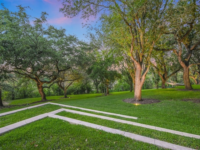 view of home's community featuring a lawn