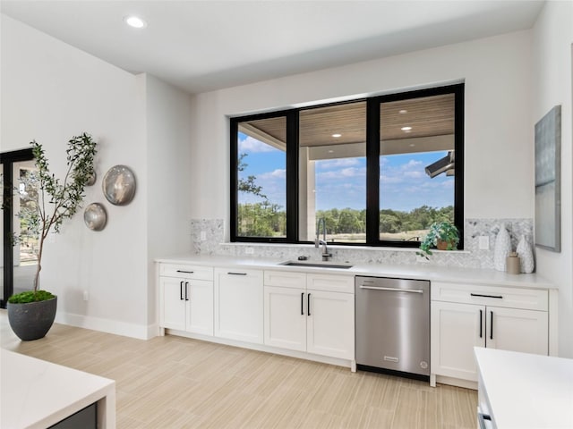 bar with white cabinetry, sink, backsplash, and dishwasher