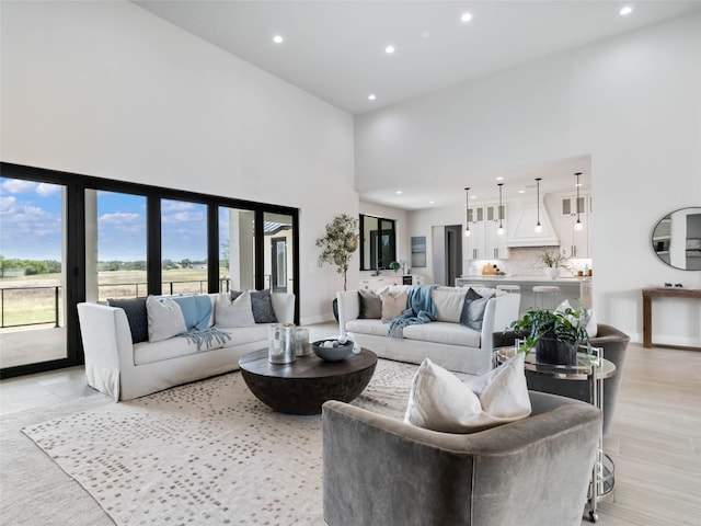 living room featuring a high ceiling