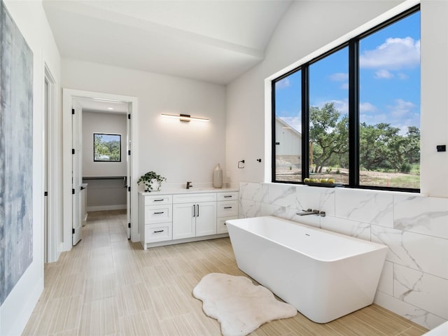 bathroom featuring vanity and a bathtub