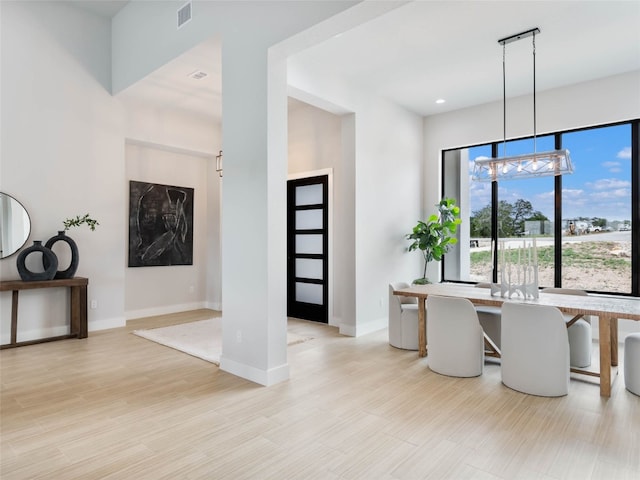 dining area featuring light wood-type flooring